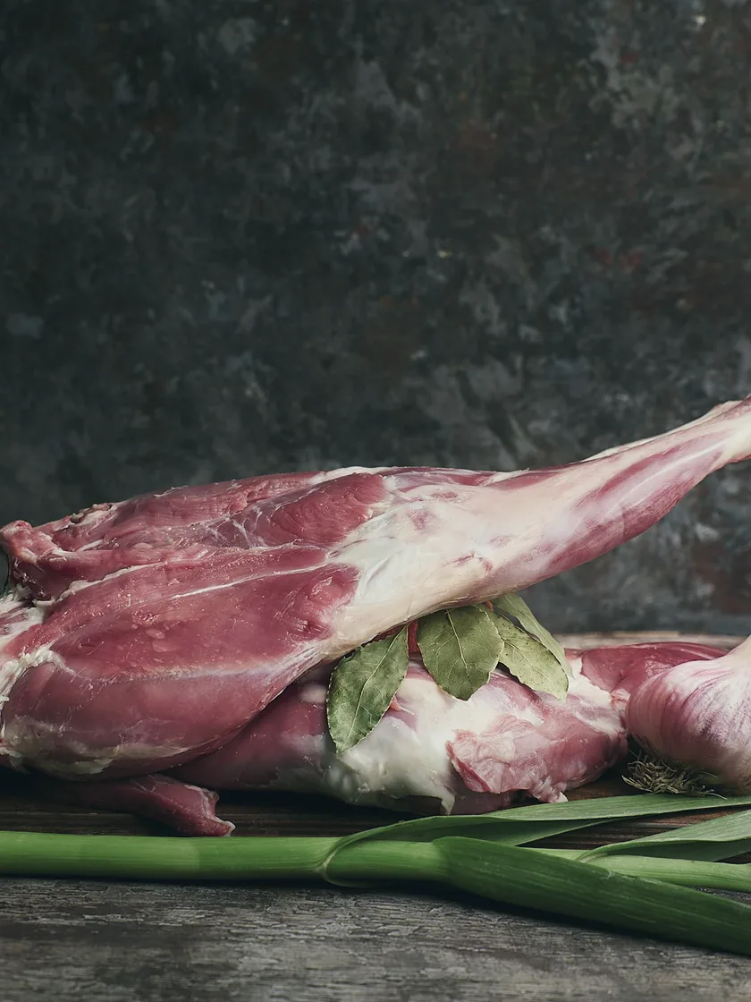 Raw lamb shanks with bay leaf